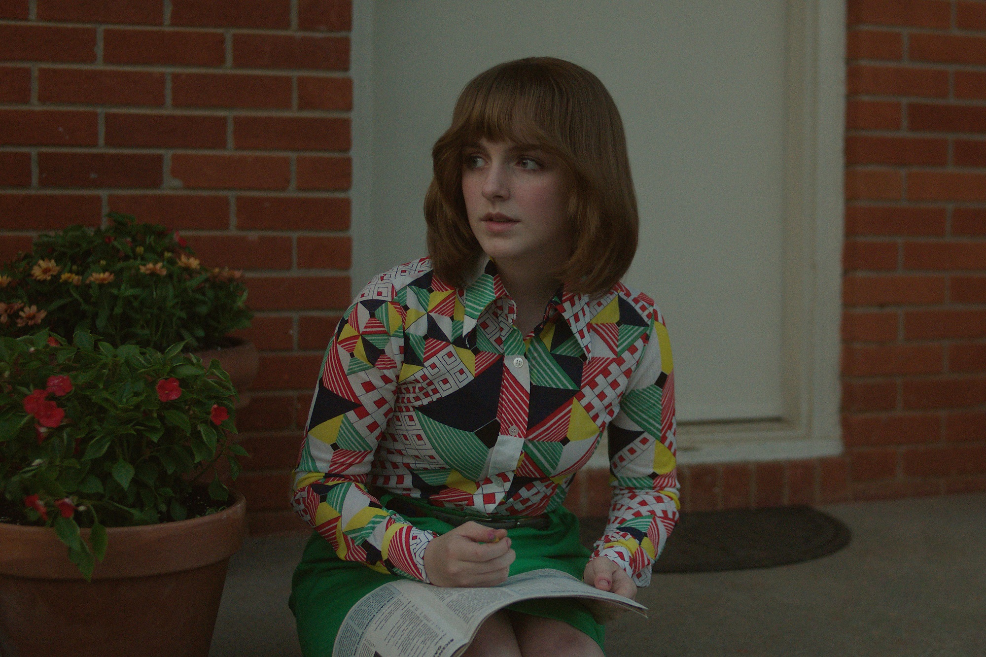 'A Friend of the Family': McKenna Grace as Jan Broberg sitting on the porch steps