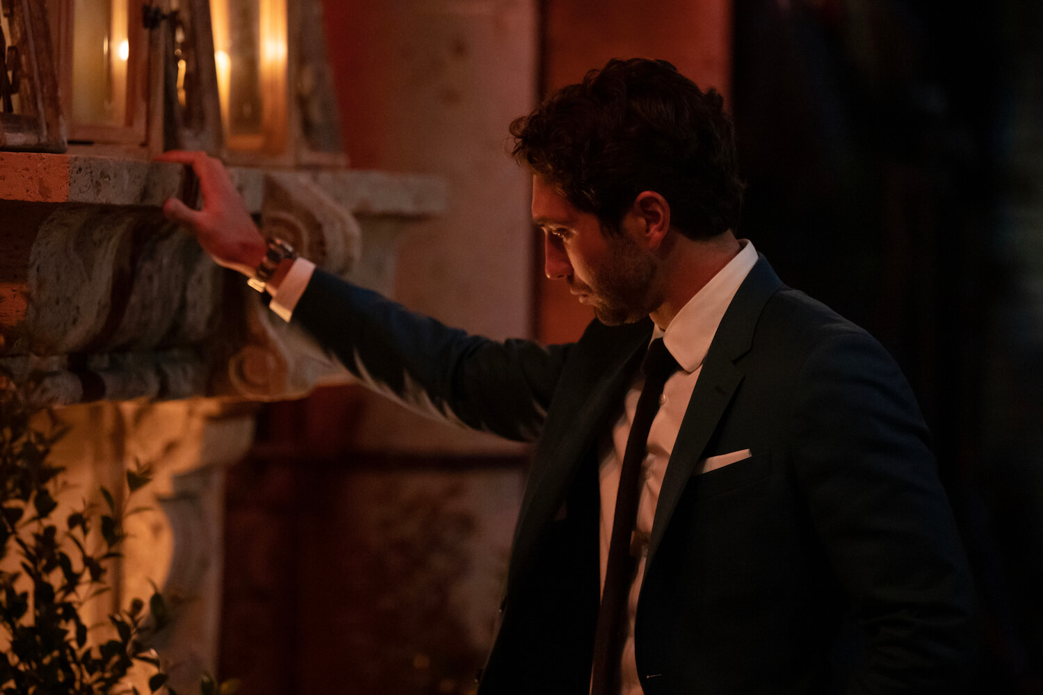 Joey Graziadei standing in front of a fireplace during 'The Bachelor' 2024 premiere