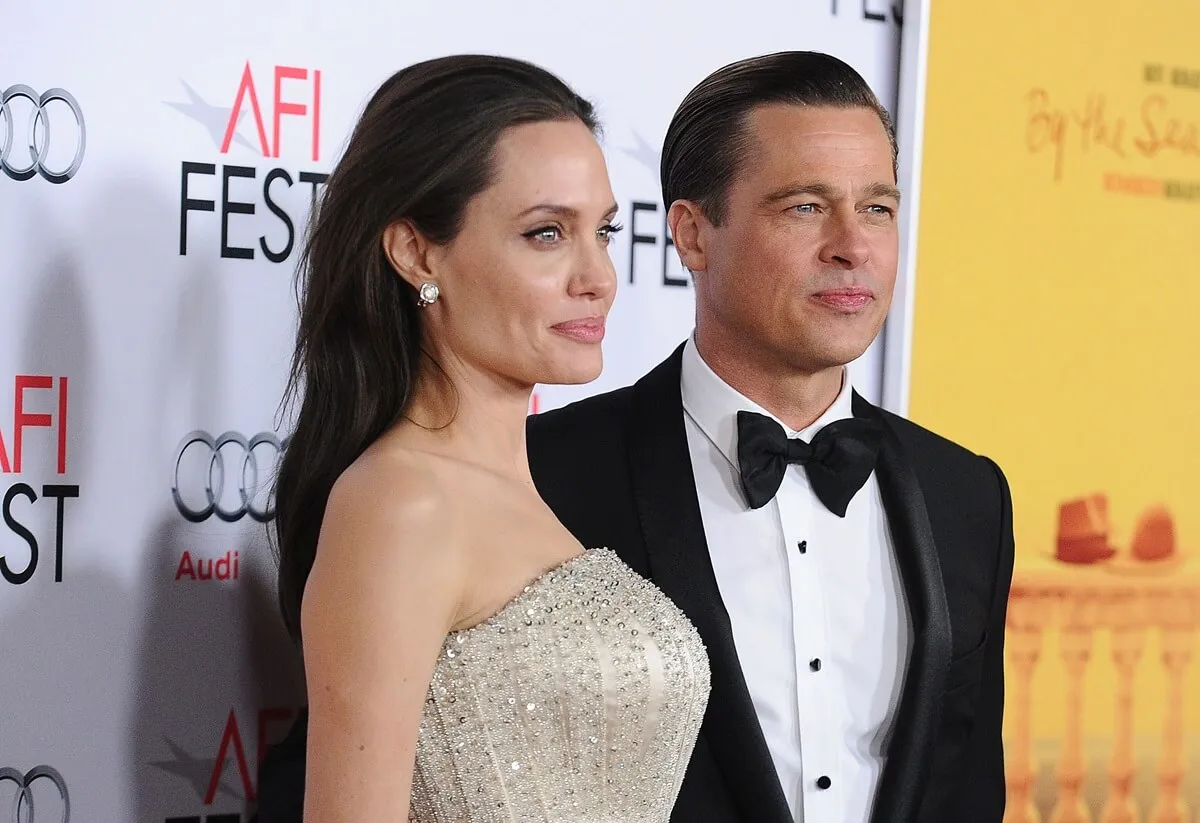 Angelina Jolie and Brad Pitt posing at the premiere of "By the Sea" at the 2015 AFI Fest.