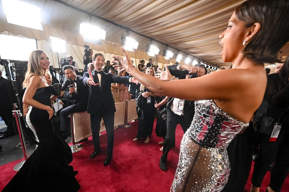 Georgina Chapman, Adrien Brody, and Halle Berry on the red carpet at the 97th Oscars in Hollywood, California