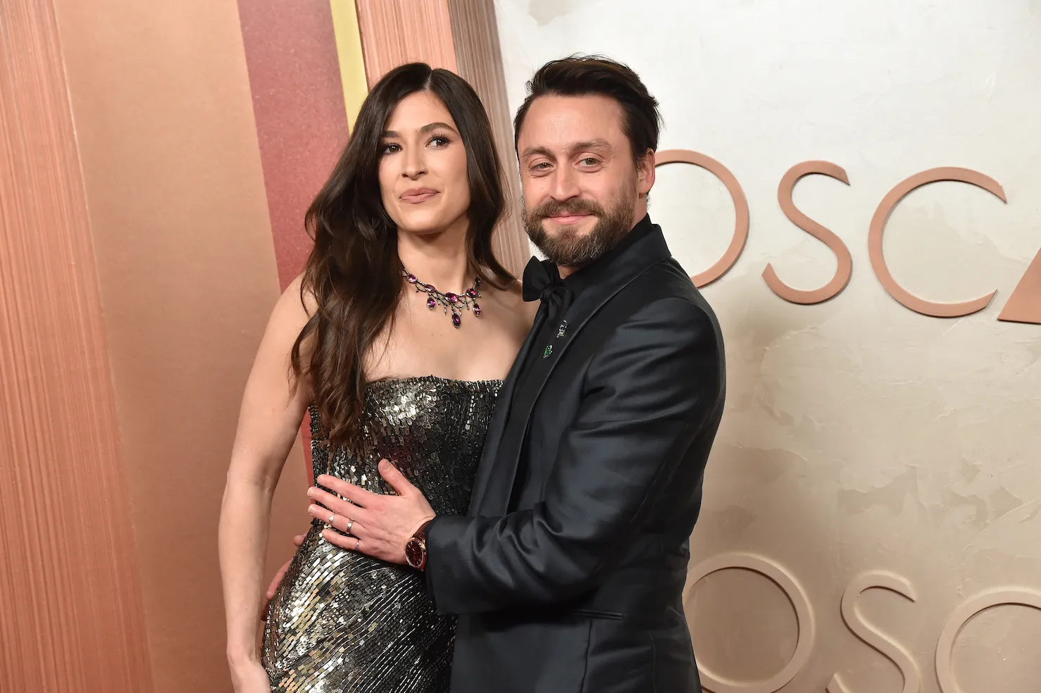 Kieran Culkin and his wife, Jazz Charton, posing at the 97th Academy Awards
